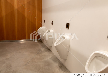 Public male toilet a line of urinals Public male toilet a line of urinals 103462723