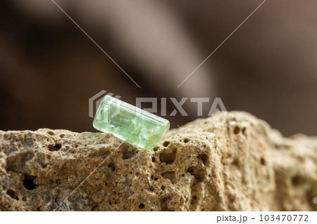 Raw Green Tourmaline Crystal on Rough Stone 103470772