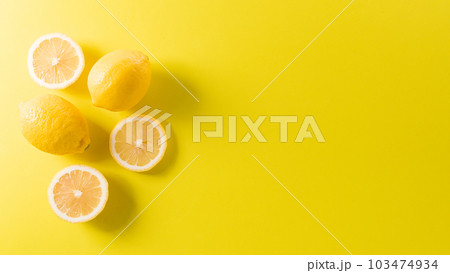 Summer composition made from oranges, lemon or lime on pastel yellow background. Fruit minimal concept. Flat lay, top view, copy space. 103474934