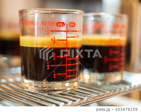 perfect double shot espresso hot black coffee crema aroma morning glass cup drink espresso machine coffee maker fresh cafe caffeine brown beverage barista bar breakfast background selected focus perfect double shot espresso hot black coffee crema aroma morning glass cup drink espresso machine coffee maker fresh cafe caffeine brown beverage barista bar breakfast background selected focus 103478159