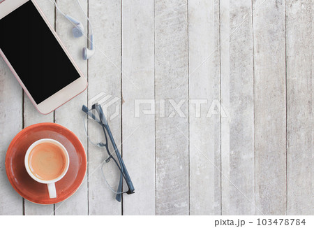 Coffee cup and smart phone on wood background. Coffee cup and smart phone on wood background. 103478784