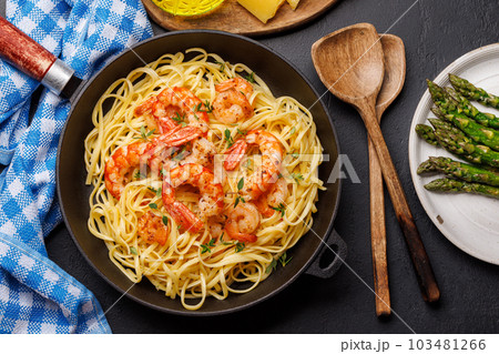 A delightful Italian pasta adorned with shrimps 103481266