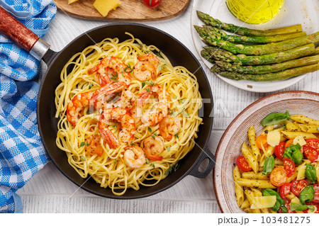A delightful Italian pasta adorned with shrimps A delightful Italian pasta adorned with shrimps 103481275