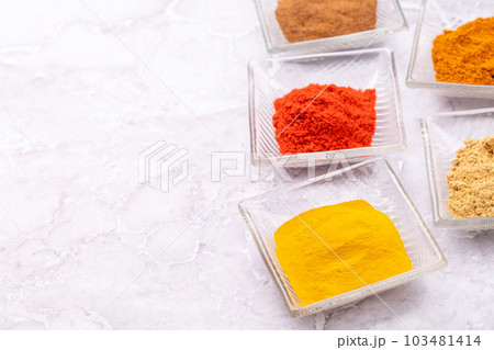 Various dried spices in small bowls Various dried spices in small bowls 103481414