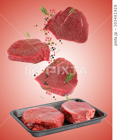 Pieces of beef steak in a black disposable polystyrene plate on a white isolated background 103481929