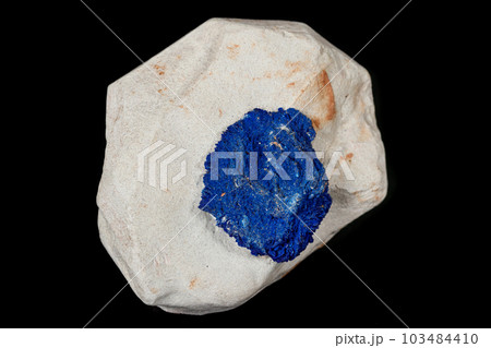 Macro mineral stone Azurite in siltstone against black background 103484410
