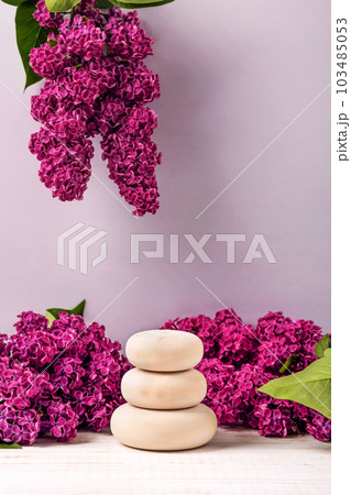 Wood stones podium and lilac flowers. Concept scene stage showcase for new product, banner, promotion sale, cosmetic, presentation 103485053