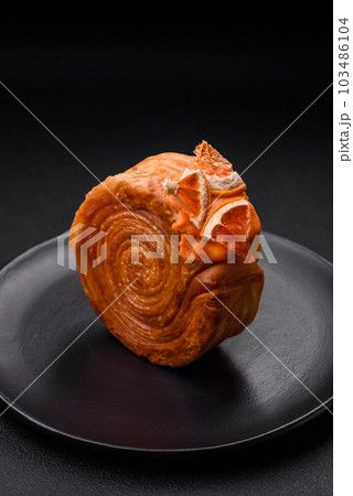 Round puff pastry croissant with citrus filling or New York roll Round puff pastry croissant with citrus filling or New York roll 103486104