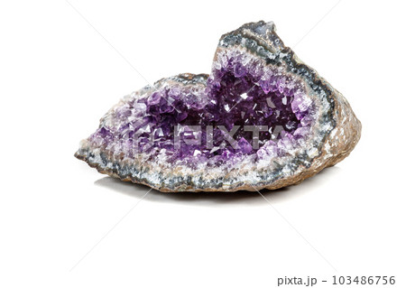 Macro Mineral Stone Amethysts in the rock on a white background 103486756