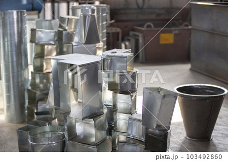 Workshop in the factory for the manufacture of ventilation pipes. Ventilation metal pipes. Workshop in the factory for the manufacture of ventilation pipes. Ventilation metal pipes. 103492860