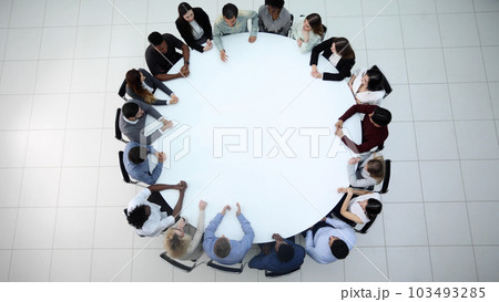 Businesspeople Sitting At Conference Round Table At The Meeting Businesspeople Sitting At Conference Round Table At The Meeting 103493285