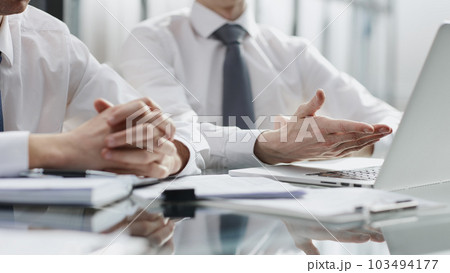 Close-up business men discussing a project, brainstorming, sharing ideas Close-up business men discussing a project, brainstorming, sharing ideas 103494177