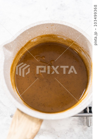 Cooking Swedish meatball sauce in a nonstick cooking pot. 103499368