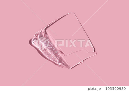 Texture of cosmetic gel on a pink background. Texture of cosmetic gel on a pink background. 103500980