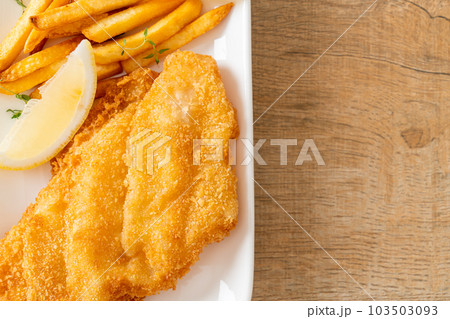 fish and chips - fried fish fillet with potatoes chips fish and chips - fried fish fillet with potatoes chips 103503093