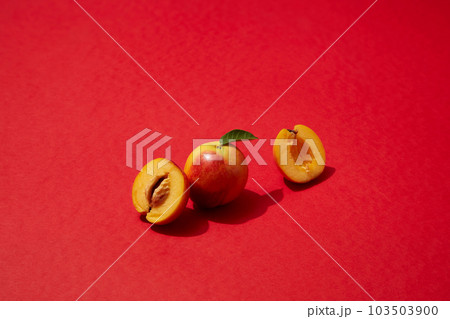 A peach and a peach cut in half are displayed on red plane. Peach (Prunus persica) may help keep your peepers healthy thanks to an antioxidant in peaches A peach and a peach cut in half are displayed on red plane. Peach (Prunus persica) may help keep your peepers healthy thanks to an antioxidant in peaches 103503900