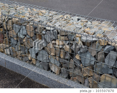 Decorative fence of bulk stone in the grid 103507870