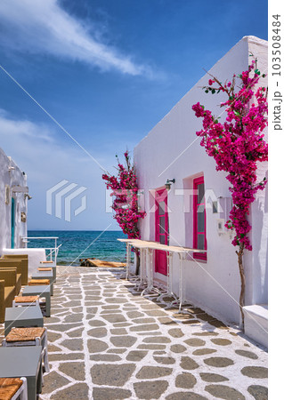 Beautiful alleyway of Greek island towns open to seafront on sunny day Beautiful alleyway of Greek island towns open to seafront on sunny day 103508484