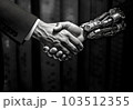 The hand of a man in a suit shakes the hand of a robot 103512355