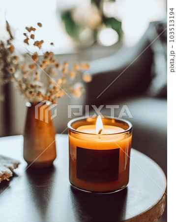 Burning candle mockup, styled home interior decor with amber glass candle jar with label template Burning candle mockup, styled home interior decor with amber glass candle jar with label template 103513194