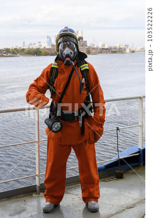 Fireman. Fire fighting equipment. Fire drill. Seaman with fire-fighters outfits and Breathing apparatus. Fireman. Fire fighting equipment. Fire drill. Seaman with fire-fighters outfits and Breathing apparatus. 103522226
