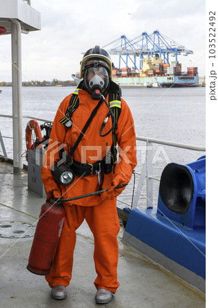 Fireman. Fire fighting equipment. Fire drill. Seaman with fire-fighters outfits and Breathing apparatus. Fireman. Fire fighting equipment. Fire drill. Seaman with fire-fighters outfits and Breathing apparatus. 103522492
