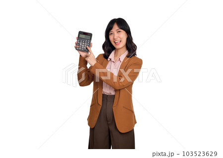 Tax day concept. Asian woman confident smiling holding calculator and finger point device, Portrait happy Asian female isolated on white background, Account and finance counting income Tax day concept. Asian woman confident smiling holding calculator and finger point device, Portrait happy Asian female isolated on white background, Account and finance counting income 103523629