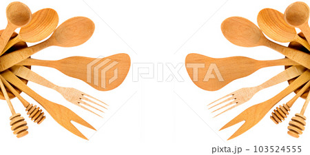 Set of wooden spoons, spatulas and forks isolated on a white . Collage. Free space for text. Wide photo. 103524555