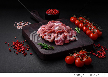 Raw chicken or turkey gizzards with salt, spices and herbs Raw chicken or turkey gizzards with salt, spices and herbs 103524902