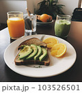 Tasty breakfast with avocado toast and orange juice  103526501