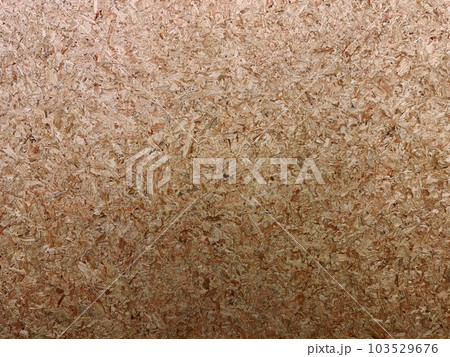 細かい木片を圧縮した茶色のパーティクルボードの表面の背景画像 103529676