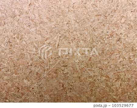 細かい木片を圧縮した明るい茶色のパーティクルボードの表面の背景画像 103529677