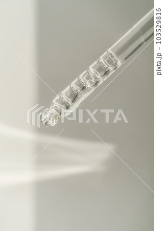 Pipette with bubbles on a white background. Pipette with bubbles on a white background. 103529816
