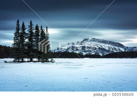 Two Jack Lake with Mount Rundle and pine forest in winter on the evening at Banff national park Two Jack Lake with Mount Rundle and pine forest in winter on the evening at Banff national park 103530020