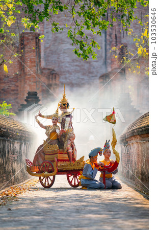 Asian man and woman with Thai old traditional dress stay together on traditional chariot in front Asian man and woman with Thai old traditional dress stay together on traditional chariot in front 103530646