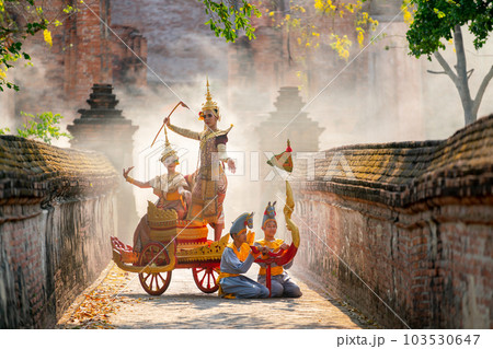 Asian man and woman with Thai old traditional dress stay together on traditional chariot in front Asian man and woman with Thai old traditional dress stay together on traditional chariot in front 103530647