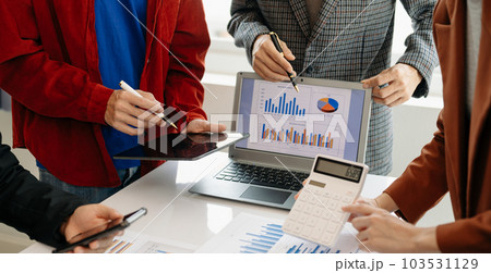 Business team meeting present.professional investor working with  Finance managers task. with laptop smart phone and digital tablet in morning light. 103531129
