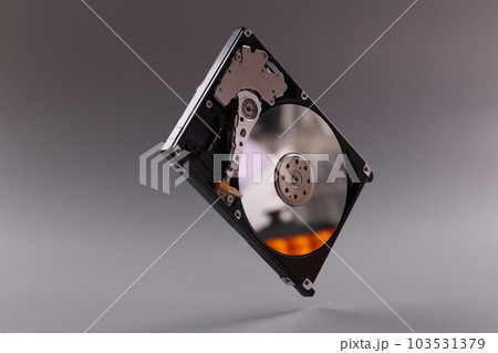 Closeup of hardware of internal mechanism of hard drive 103531379