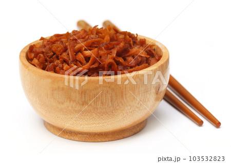 Dried dessert made of sliced carrot Dried dessert made of sliced carrot 103532823