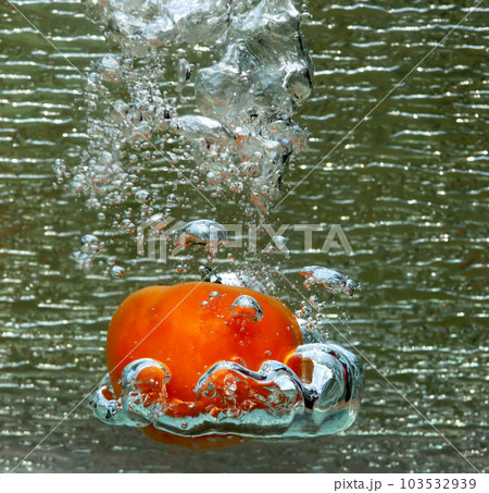 Splash of a red tomato Splash of a red tomato 103532939