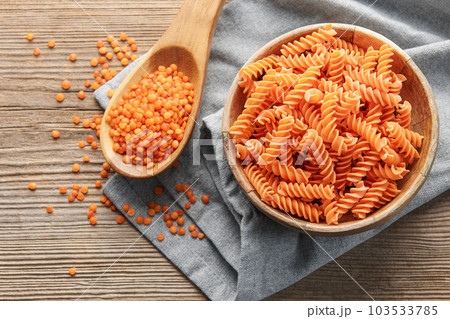 Fusilli red lentil pasta on a old wooden background. 103533785