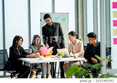 Group of business man and woman sit around the table to discuss about project with the manager Group of business man and woman sit around the table to discuss about project with the manager 103540391