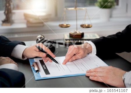 Business people signing a contract Business people signing a contract 103541107