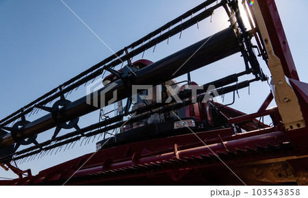Close up of combine harvester for harvesting wheat 103543858