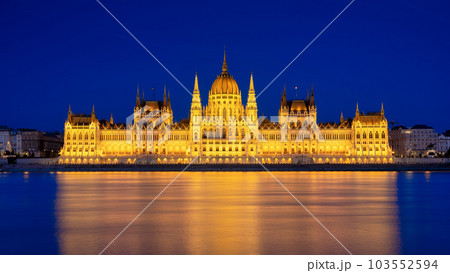 Parliament building in Budapest, Hungary. Parliament and reflections in the Danube River.  103552594