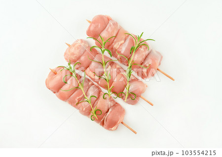 Skewers from raw chicken leg meat without skin for a supermarket on a white background.Food for retail.Chicken skewers.Chicken meat.Procurement for designers. Skewers from raw chicken leg meat without skin for a supermarket on a white background.Food for retail.Chicken skewers.Chicken meat.Procurement for designers. 103554215