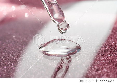 Cosmetic pipette with a pink on dark background. 103555677