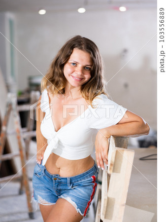 Sexy woman posing in building site Sexy woman posing in building site 103556889