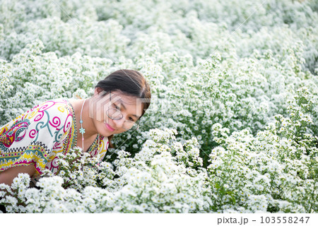 Woman (LGBTQ) posing at flower park garden field 103558247