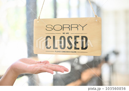 A coffee shop or restaurant front door with close sign. A coffee shop or restaurant front door with close sign. 103560856